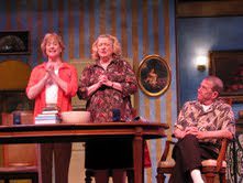 Mary (Barbara Wilson) and Margaret (Gayle Grimes) recite the Catholic "Profession of Faith" before Father Murphy (Mark Yaeger). Photo courtesy of Reston Community Players.