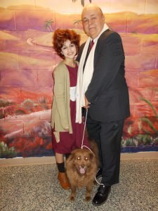 Annie (Julia Salatti) with Daddy Warbucks (Chuck Dick), and Sandy the Dog (Doozer). Photo by Sharon Steele.