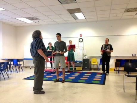 Director Robert Michael Oliver (left) in rehearsal with the cast of 'Legal Tender.'