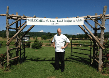 Airlie House Executive Chef Jeff Witte at the entrance to the kitchen gardens. Photo by Joran Wright.