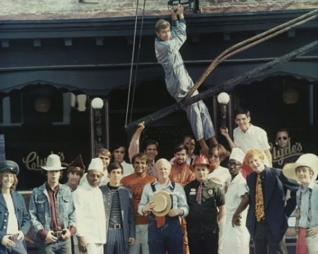 Clyde’s in Georgetown; Stuart Davidson hanging from fire escape; John Laytham in the bib overalls holding straw boater.