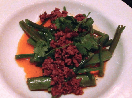Ground pork chili pepper ragout in a tangy tamarind sauce with green beans and water morning glory stems.