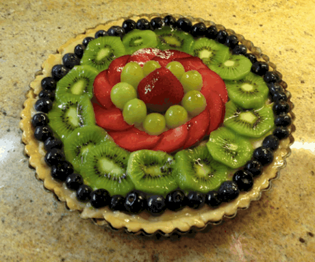 9 ½ inch tart with strawberry, green grapes, red plums, kiwi fruit, and blueberries.