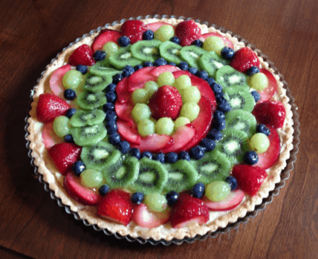 12 ½ inch tart with strawberries, green grapes, red plums, blueberries and kiwi fruit.