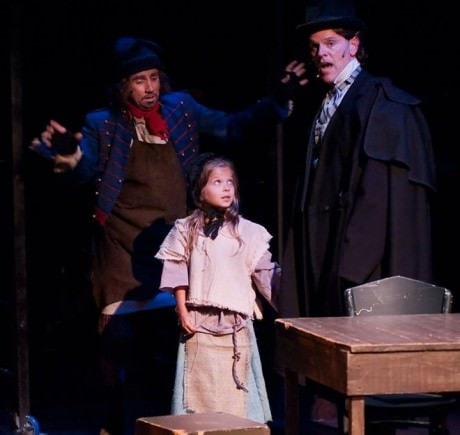 David James (Thènardier), Daniel Felton (Jean Valjean), and  Caroline Otchet (Young Cosette). Photo by Kirstine Christinasen.