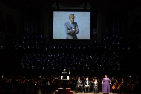 The Choral Arts Chorus and Soprano Jonita Lattimore sing the “Libera Me” from Verdi’s Requiem, featuring images of President John F. Kennedy. Photo by Russell Hirshorn.