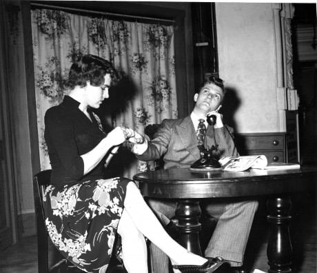 MIDN David Travis (class of 1951) as Peggy and MIDN Ace Boughton (class of 1949) in the Masqueraders’ 1948 production of 'Boy Meets Girl.'