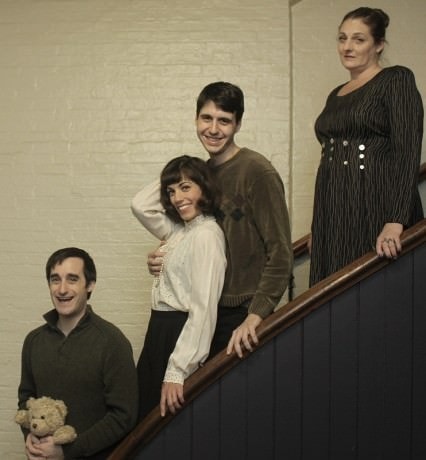 The Pascal Family ascending the stairs: Anthony (Brian M. Kehoe), Jackie-O (Melody Easton), Marty (Eric Paul Boesche), and Mrs. Pascal (Deb Carson). Photo courtesy of The Mobtown Players.