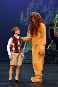 Aslan (Sean Hackes) shares kind and wise words with Edmund Pevensie (Thomas Schindler). Photo courtesy of Encore Stage & Studio.
