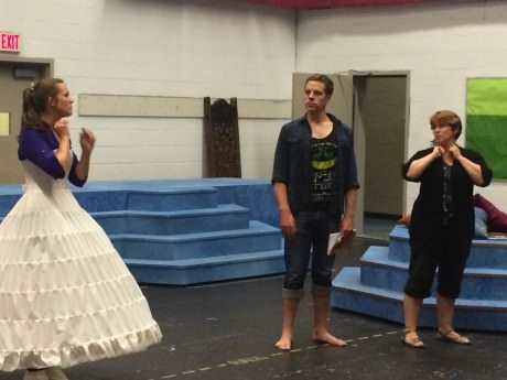 Director Carolyn Coulson rehearses with Anna (Jenna Pinchbeck) and The King (Russell Rinker).