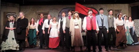  The cast of 'Les Misérables' singing 'One Day More.' Photo courtesy of Way Off Broadway Dinner Theatre. 