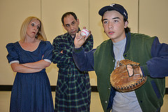 Eugene (Casey Baum) is again in trouble with his mom (Nora Zanger) and dad (Steve Feder) for playing ball. Photo by Andy Culhane.