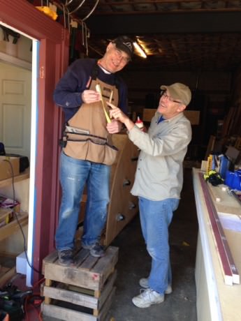 Master carpenters Bill Rippey and Jim Korte (holding tape measure). Photo by Elli Swink. 