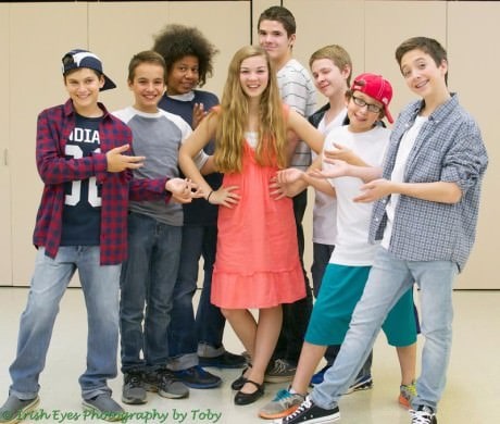 Kendra surrounded by the boys who adore her at middle school. Featuring (from left to right) Ryan Selig, Cole Sitilides, Winston Oughourli, Izzy Gaskill, Brett Hungar, Will Hemmingson, Alex Weinstein, and Cuinn Casey. Photo by Irish Eyes Photography by Toby.