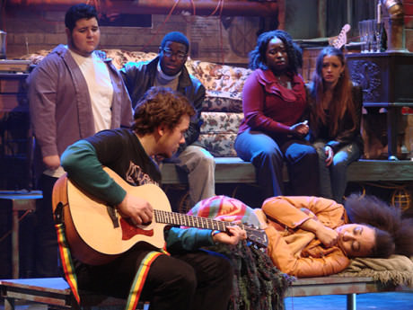 Roger Serenades Mimi: Roger (Jake Meile), and Mimi (Rachel Johnson). Background (from left) Mark (Jason Guerrero), Collins (Stephen Greenhill), Joanne (Awa Sal Secka), and Maureen (Lyndsay Rini). Photo courtesy of Montgomery College.
