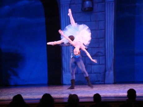  Alexander Collen (Prince) holds Nicole Kelsch (Cinderella) over his head. Photo by Bud Johnson.