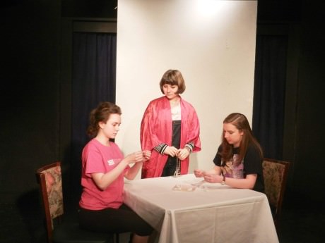 Juliet Beach, Erica Ridge, and Morgan Wenerick appear in “Misfortune,” a one act play by Mark Harvey. Photo by Larry Simmons.