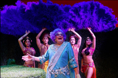 Dame Edna with giant purple ostrich fans. Photo by Craig Schwartz.