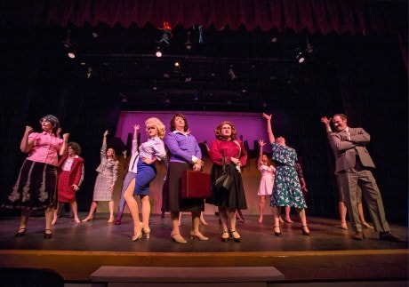At center Doralee (Lucy Bobbin, r), Violet (Robyn Bloom, c), and Judy (Caitlin Grant, l); surrounded by Mr. Hart (Richard Greenslit). Photograph by Scott Kramer.