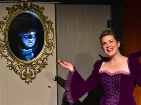 Christian Faulkner (the mirror) with evil Queen (Charlene Sloan). Photo by Chip Gertzog, Providence Players.