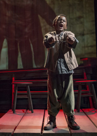 Jeremiah Hasty (Little Freddie) at the end of Act 1 of 'Uprising.' Photo by Chris Banks.