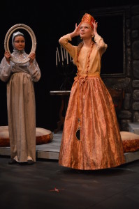 The Queen (Nadya Steare) asks the Magic Mirror (Ella McHugh) who is the fairest of them all. Photo by Larry McClemons.