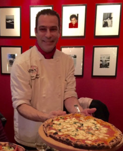 Chef Mauro Mollino of Lena’s with one of his Neapolitan wood-fired pizzas.