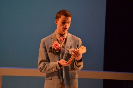 Giuliano (David Brewer) with one of his many Barbie dolls. Photo by Emily Pound.