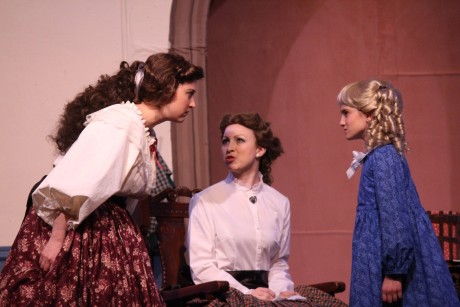 The Sisters square off. From left to right: Jo (Heather Norcross), Meg (Emily Golden), Amy (Sophia Manicone). Photo courtesy of Aldersgate Church Community Theatre.
