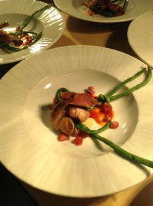 Smoked squab breast and confit leg, gently cooked long beans, cornbread sauce, vodka macerated cherries, and pearls of hot honey. Photo courtesy of Azure's facebook page.