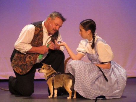Larry Keeling (The Wizard of Oz) and Princess -aka Mutt Mutt (Toto) and Lucia LaNave (Dorothy). by Michelle Macdonald.