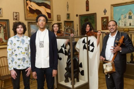 Ben Lee, Jace Clayton, and Gezachew Habtemariam (front), with violinists from the Prometheus Chamber Orchestra (behind), in Room 21 at the Barnes Foundation. Photo by Max Lakner.