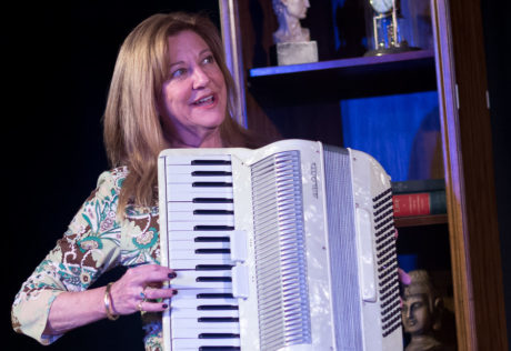 Janet Constable Preston as Claire attempting to play the accordion. Photo by Harvey Levine.
