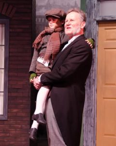 Tony Gilbert (Scrooge) and Josh Gordon (Tiny Tim). Photo by Doug Olmstead.