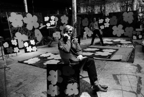 Andy Warhol, Gerard Malanga, and Philip Fagan at The Factory, New York, NY, 1964. Photo by Ugo Mulas. Courtesy and ©Ugo Mulas Heirs. All rights reserved. Andy Warhol Artwork . ©The Andy Warhol Foundation for the Visual Arts, Inc. / Artists Rights Society (ARS), New York.