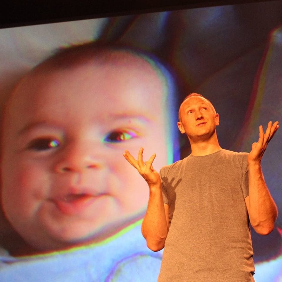 Baba Brinkman, with a projection of his son Dylan. Photo courtesy of the artist.