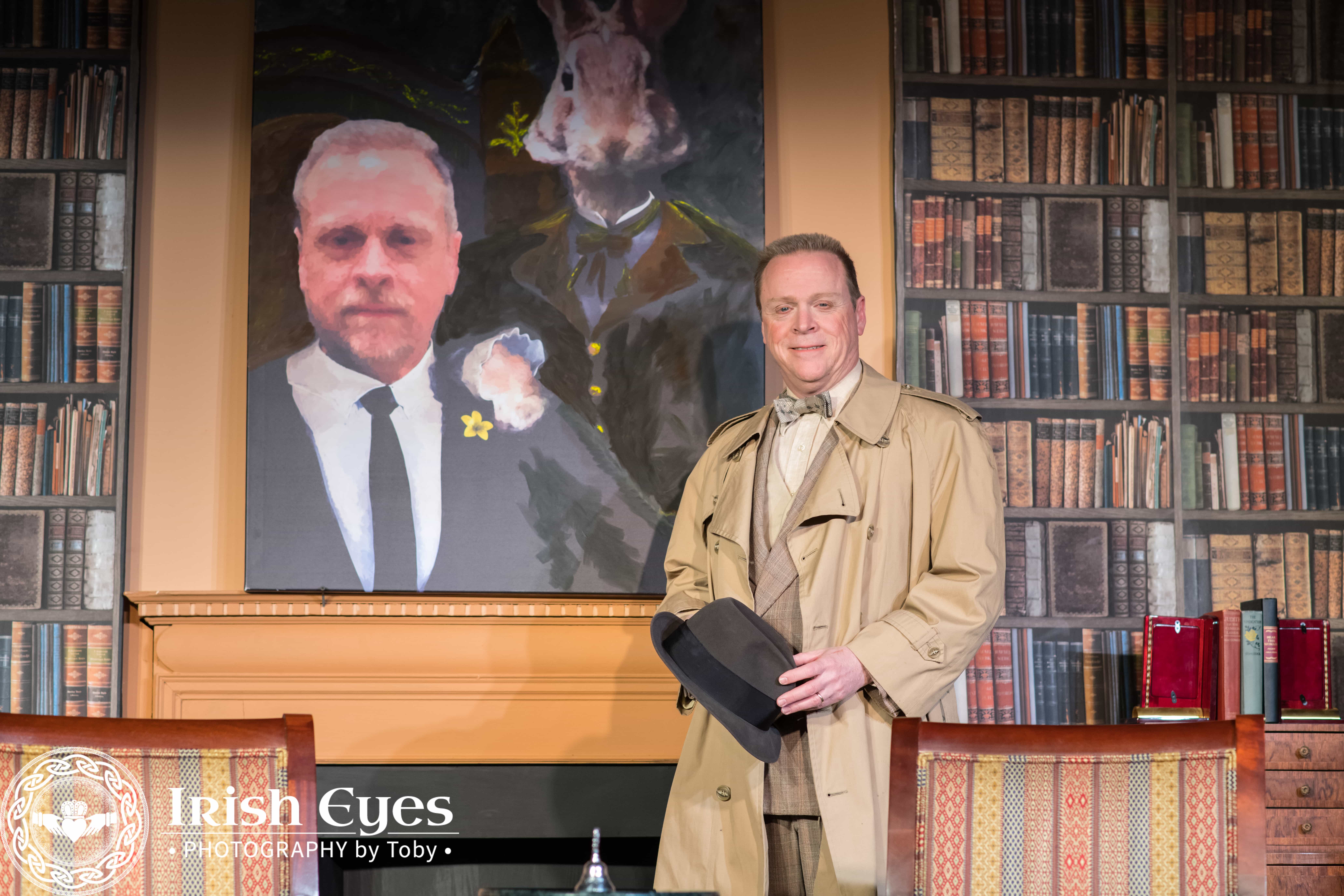 Elwood (Kevin Dykstra) in front of his portrait with Harvey. Photo credit: Irish Eyes Photography by Toby.
