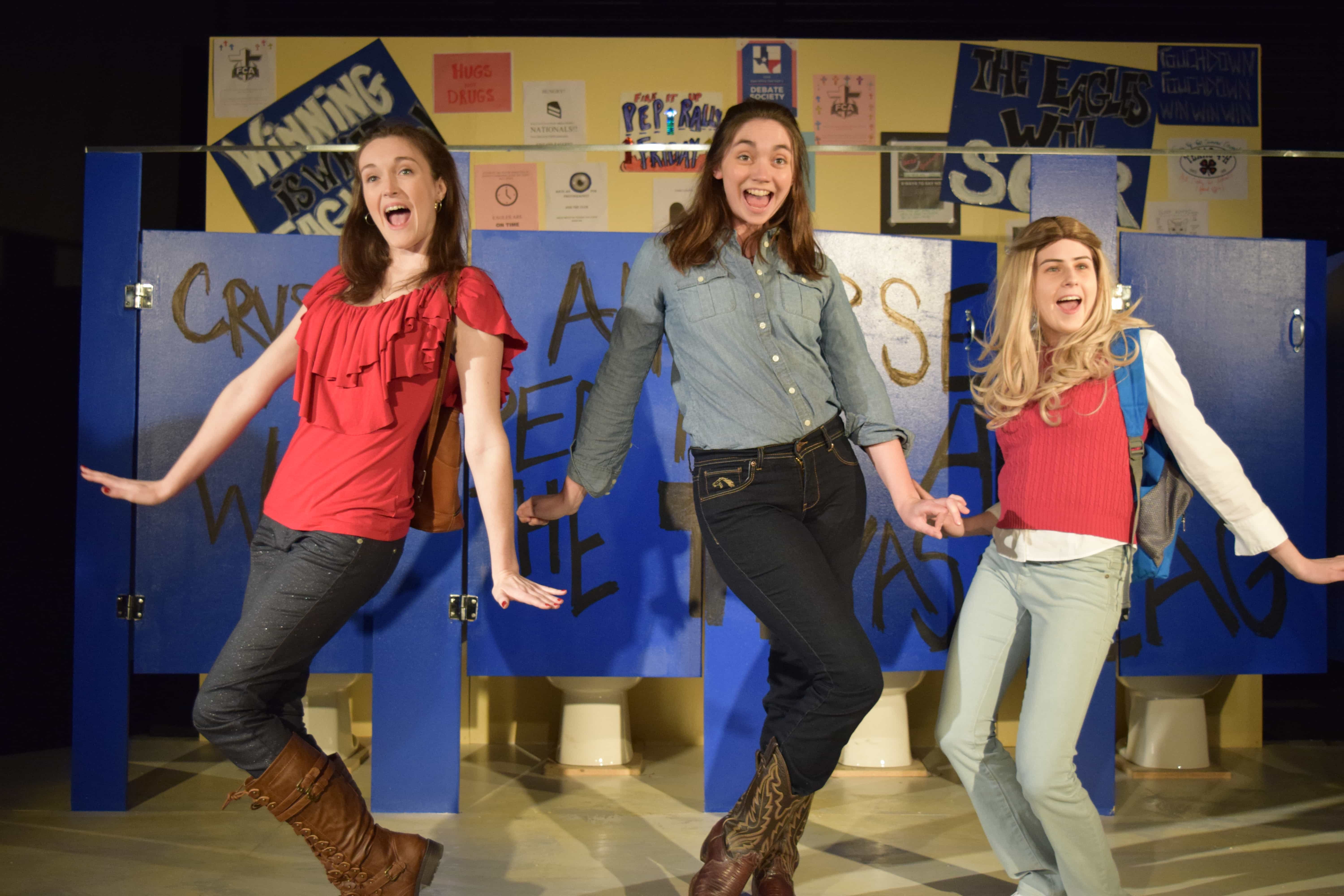Jess (Kira Burri), Tammy (Brooke Friday) and Sammy (Claire Derriennic) are excited by some gossip on the bathroom wall. Photo by Kanea McDonald.