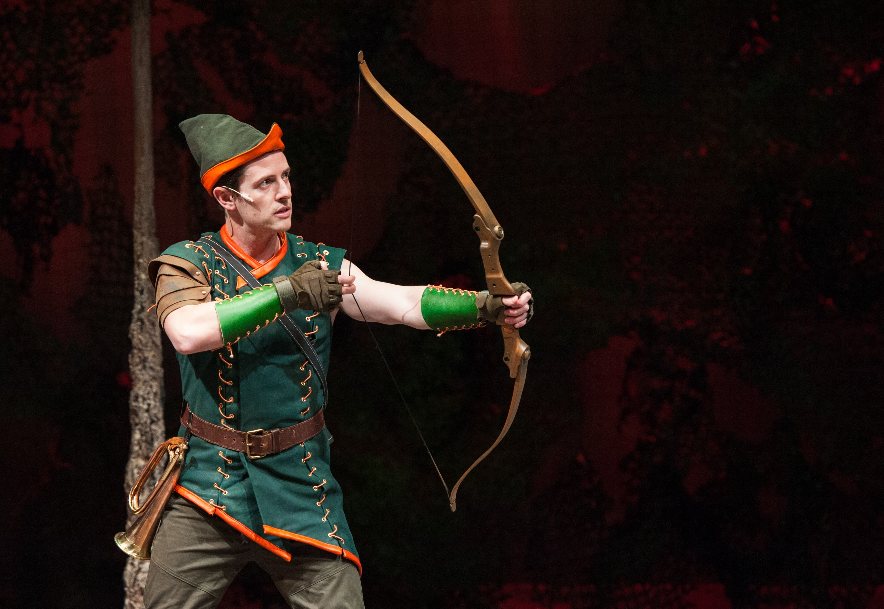 The hero Robin Hood draws his bow. [Chris Dinolfo]. Photo by Margot Schulman.