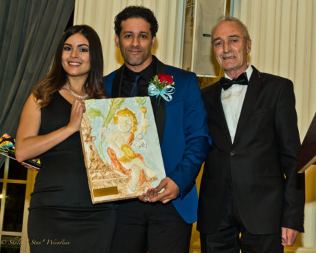 Luis Salgado (center) proudly accepts the honor from GALA's Artistic Director Hugo Medrano (right). Photo by Stan Weinstein.
