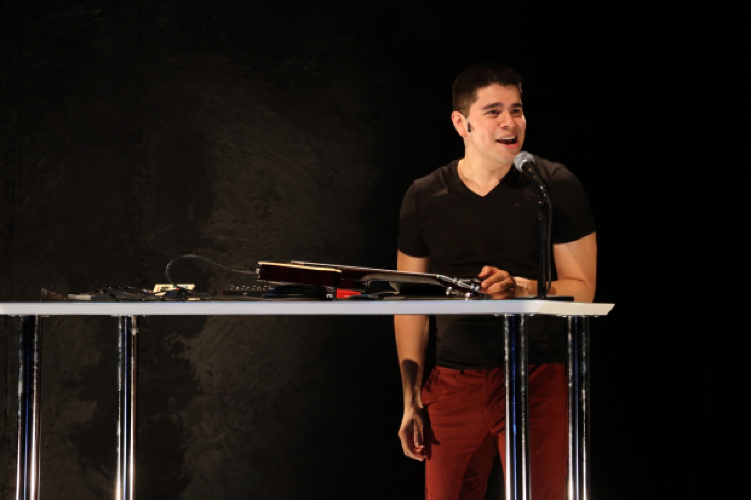 Brian Quijada mixes sound during his one-man show, Where Did We Sit On The Bus?, now playing at 1st Stage Tysons as part of the Logan Festival of Solo Performances. Photo by Gerry Goodstein.