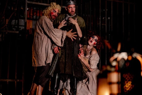 Macbeth (Ian Merrill Peakes, center) is flanked by witches (Ethan Watermeier and Rachael Montgomery) in Folger Theatre’s production of Macbeth. On stage September 4–23, 2018. Photo by Brittany Diliberto.