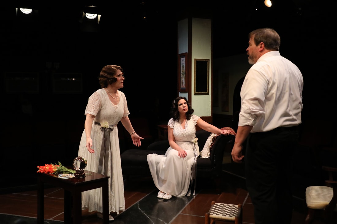 Julie Press (Ruth), Melanie Bishop (Elvira) and Thom Eric Sinn (Charles) in Spotlighters Theatre's production of Blithe Spirit. Photo credit: Spotlighters Theatre/Shealyn Jae Photography.