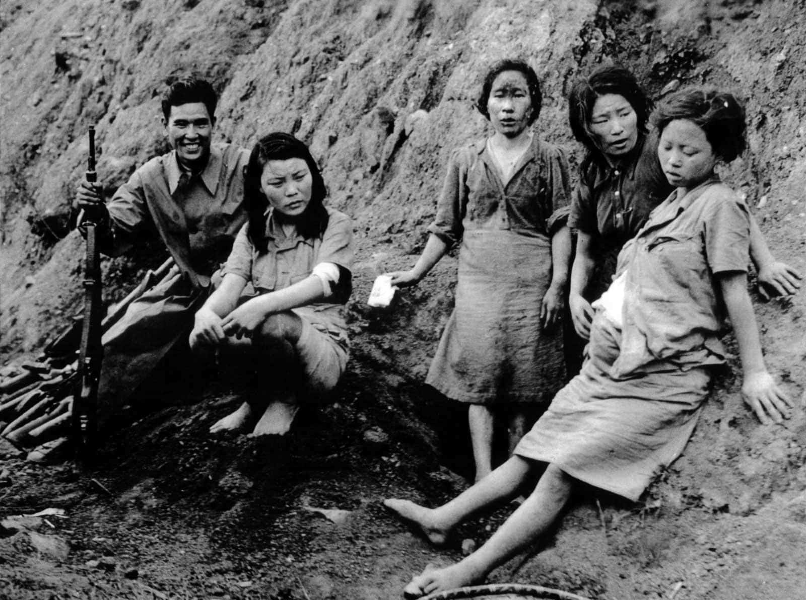 -Comfort women and prisoners of war with a Chinese soldier, September 3, 1944. Photo courtesy of the US National Archives. 