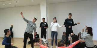 The Voices of Now ensemble in Zagreb begin the process by learning tableau skills. Photo courtesy of Arena Stage.
