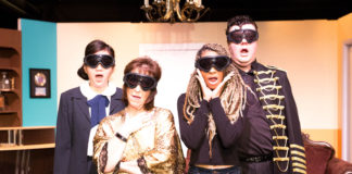 MK (Joy Liu), Beatrice (Joy Gerst), Flo (Tawny Rucker), and Mort (Brian Stepowany) watch the bomb blast in Greenbelt Arts Center's production of 'The Honey Trap.' Photo by Kimberly Curren.