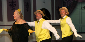 Missi Tessier, Matt Craun, and Joe Lilek perform "Be My Little Baby Bumblebee" in The British Players' Old Time Music Hall. Photo by Simmons Design.
