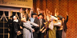 Steve Cairns (center) as Max Bialystock, with the Ensemble in The Little Theatre of Alexandria's production of 'The Producers.' Photo by Matthew Randall.