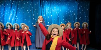 Lara Rosata as Madeline and Anna Phillips-Brown as Miss Clavel with the 12 Little Girls Ensemble in Creative Cauldron's 'Madeline's Christmas. 'Photo by William T. Gallagher.