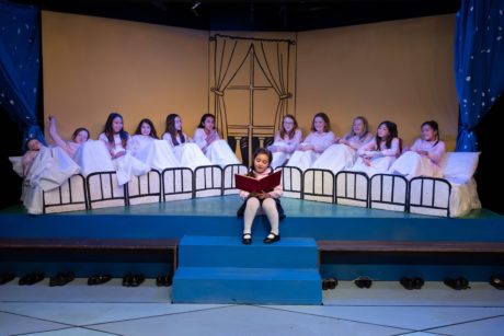 Lara Rosata (center) as Madeline reads to the 12 Little Girls ensemble in Creative Cauldron's 'Madeline's Christmas.' Photo by William T. Gallagher.